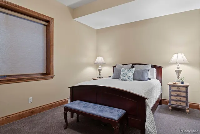 a bathroom with a sink a toilet a mirror and shower