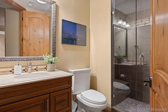 a view of a house with a small yard and a fireplace