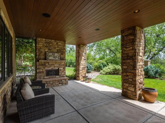 a view of a backyard with sitting area