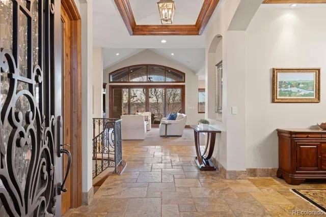 a view of a workspace with furniture and a bookshelf