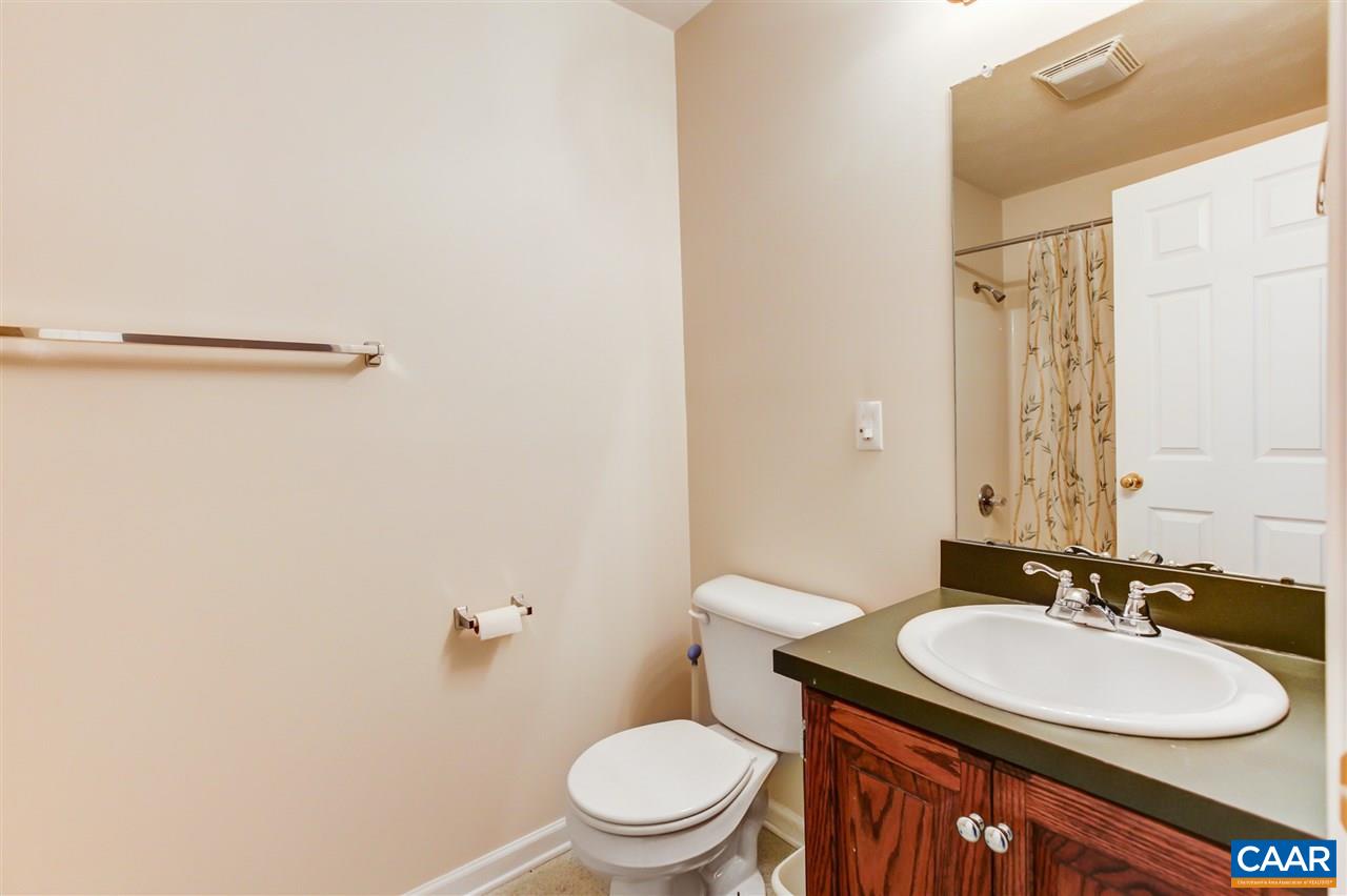 24 Sir Robin Road Waynesboro, VA 22980 - Photo 13 of 17 a bathroom with a sink vanity mirror and toilet