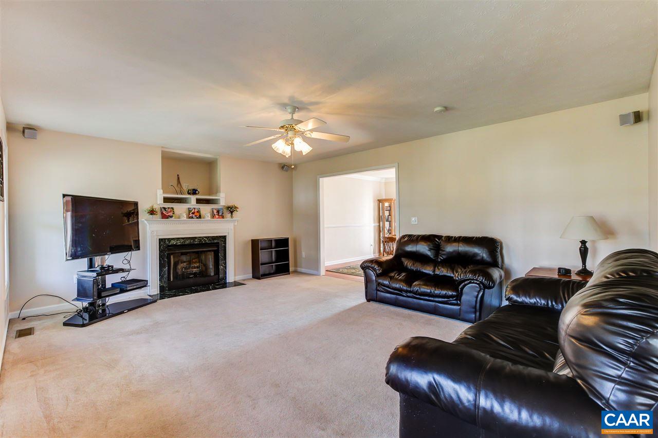 24 Sir Robin Road Waynesboro, VA 22980 - Photo 5 of 17 a living room with furniture a fireplace and a flat screen tv