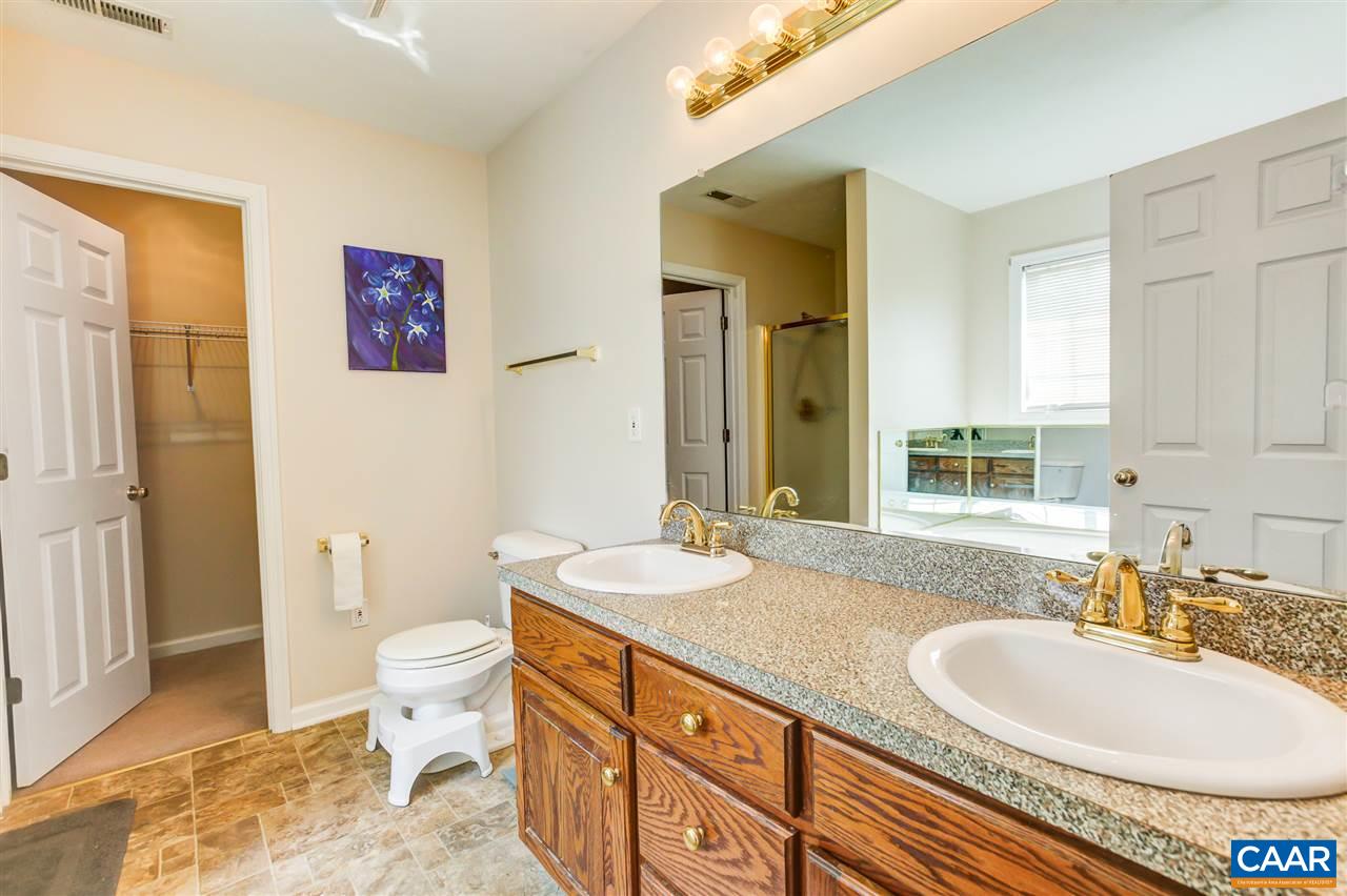 24 Sir Robin Road Waynesboro, VA 22980 - Photo 10 of 17 a bathroom with a granite countertop sink and a mirror