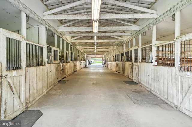 a view of a porch with wooden shelves