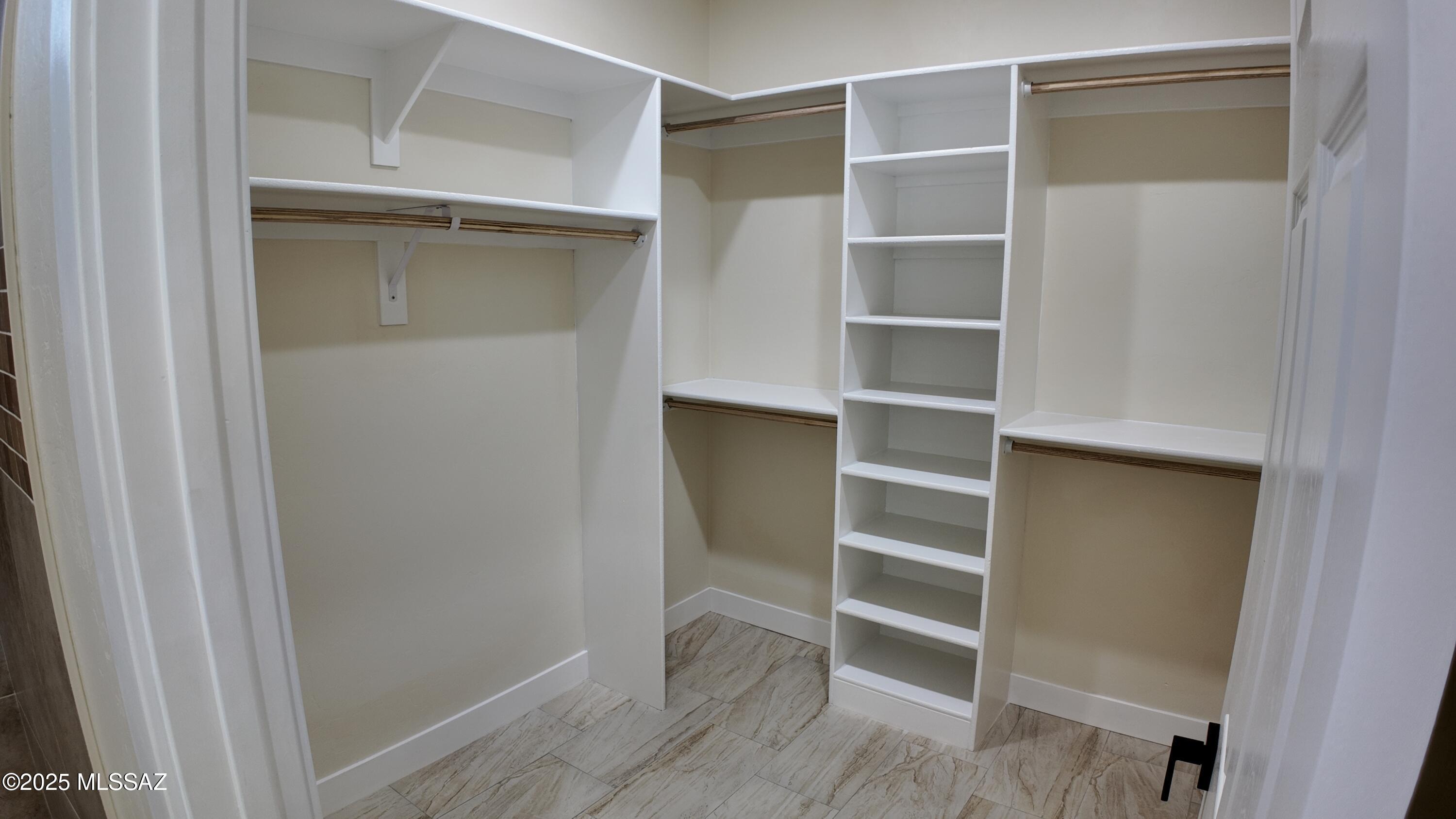 1786 Palestina Corte Rio Rico, AZ 85648 - Photo 21 of 28 a view of walk in closet with empty racks