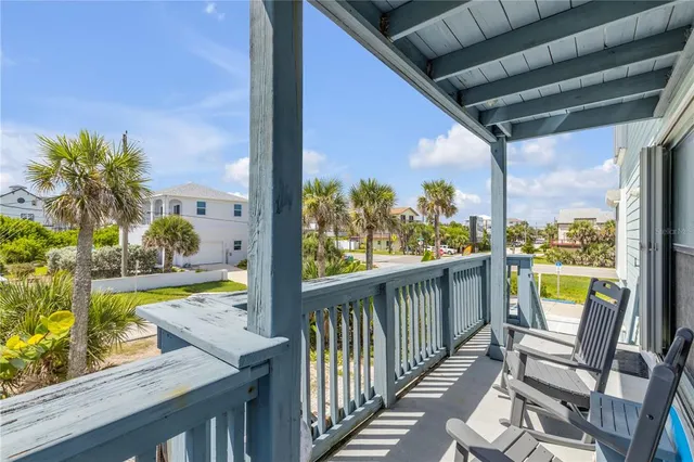 a room with pool table windows and wooden floor