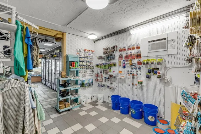 a bedroom with a bed and a tv