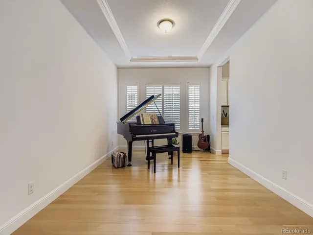 a view of a livingroom with wooden floor and a window