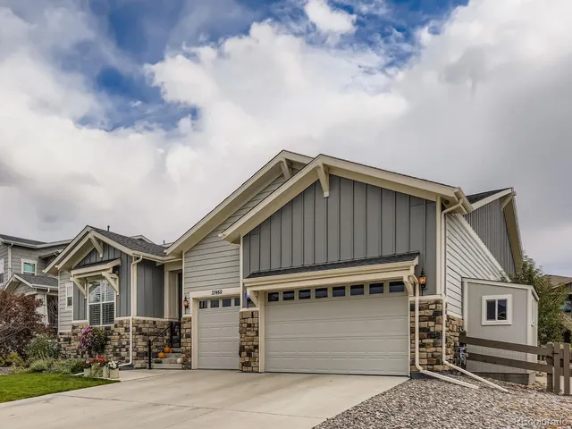 a front view of a house with a garage