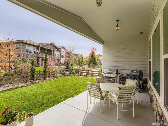 a view of an chairs and table in the patio