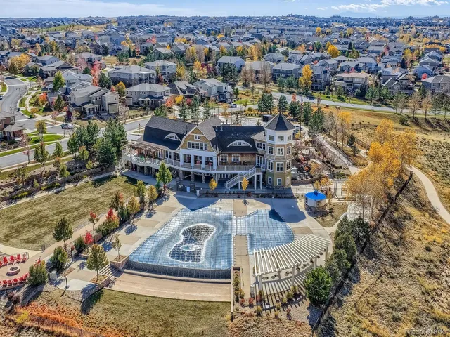 an aerial view of a house with outdoor space lake view