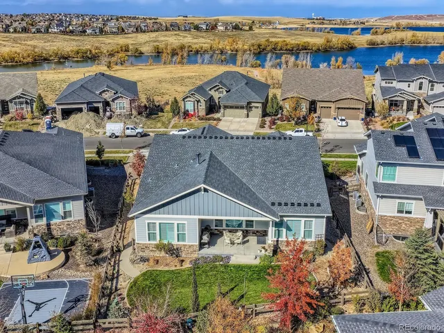 an aerial view of a house with a ocean view