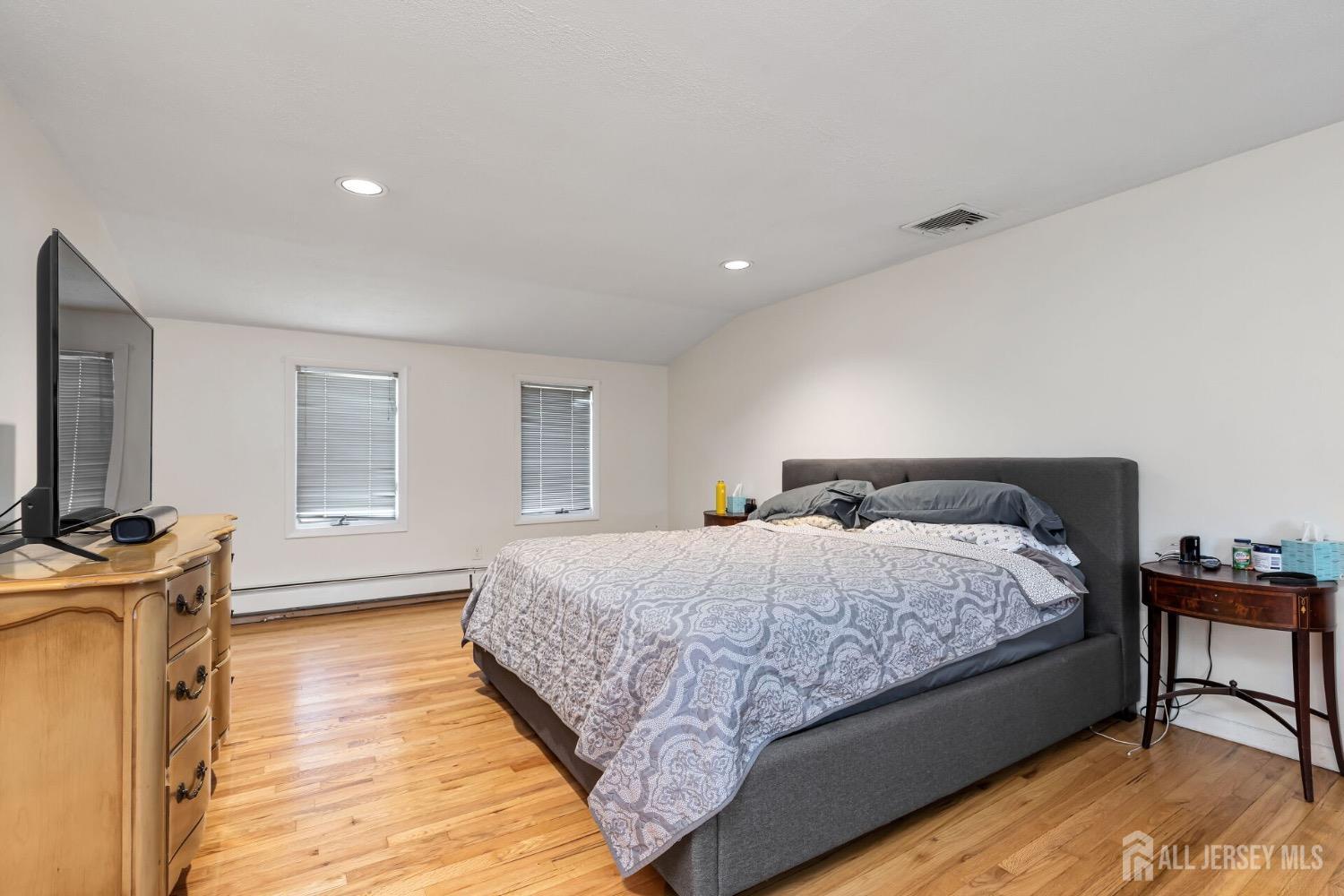 321 Overbrook Road Piscataway, NJ 08854 - Photo 19 of 46 a bedroom with a bed and a flat screen tv