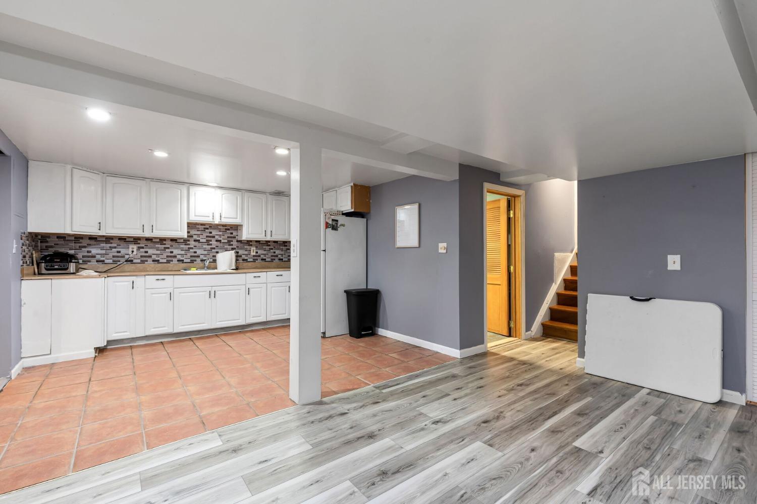 321 Overbrook Road Piscataway, NJ 08854 - Photo 26 of 46 a view of a kitchen with kitchen island a sink stainless steel appliances and cabinets