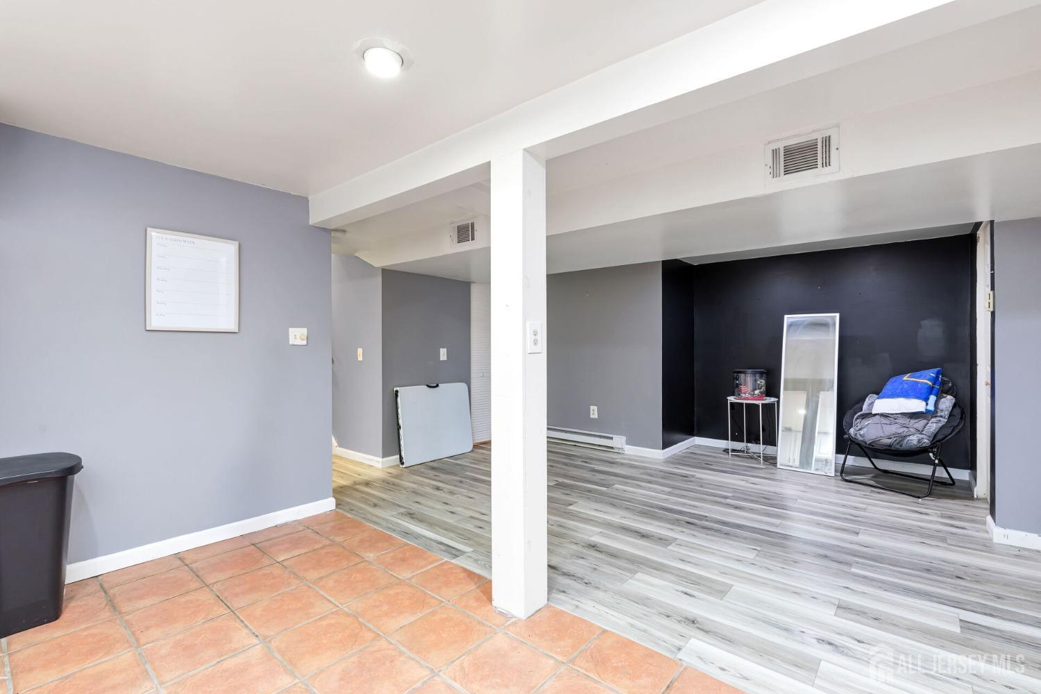 321 Overbrook Road Piscataway, NJ 08854 - Photo 27 of 46 a view of a room with wooden floor and furniture