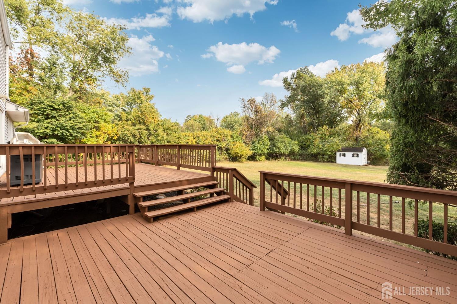 321 Overbrook Road Piscataway, NJ 08854 - Photo 32 of 46 a view of wooden deck with a lake view