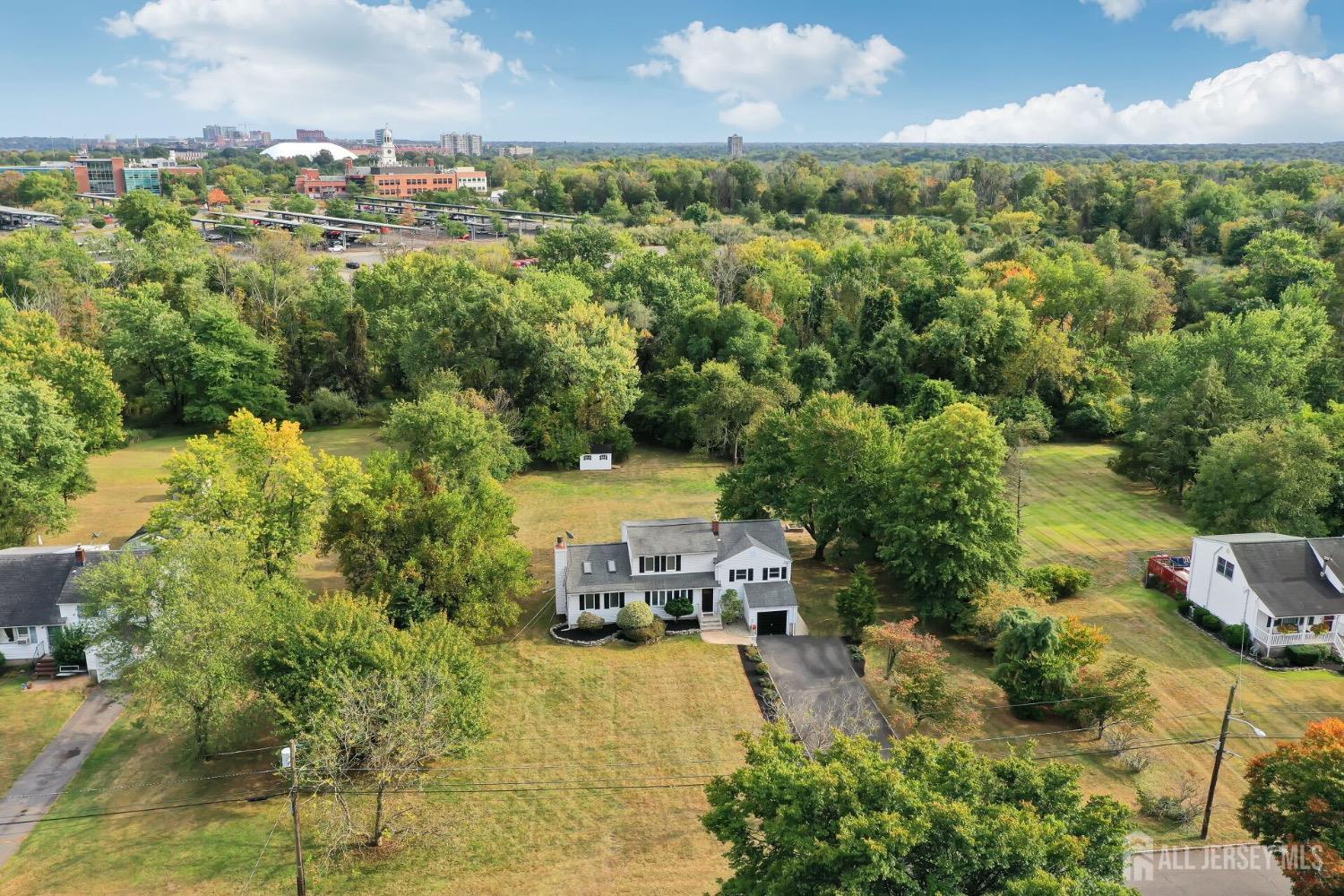 321 Overbrook Road Piscataway, NJ 08854 - Photo 39 of 46 a view of a city with lawn chairs and large trees