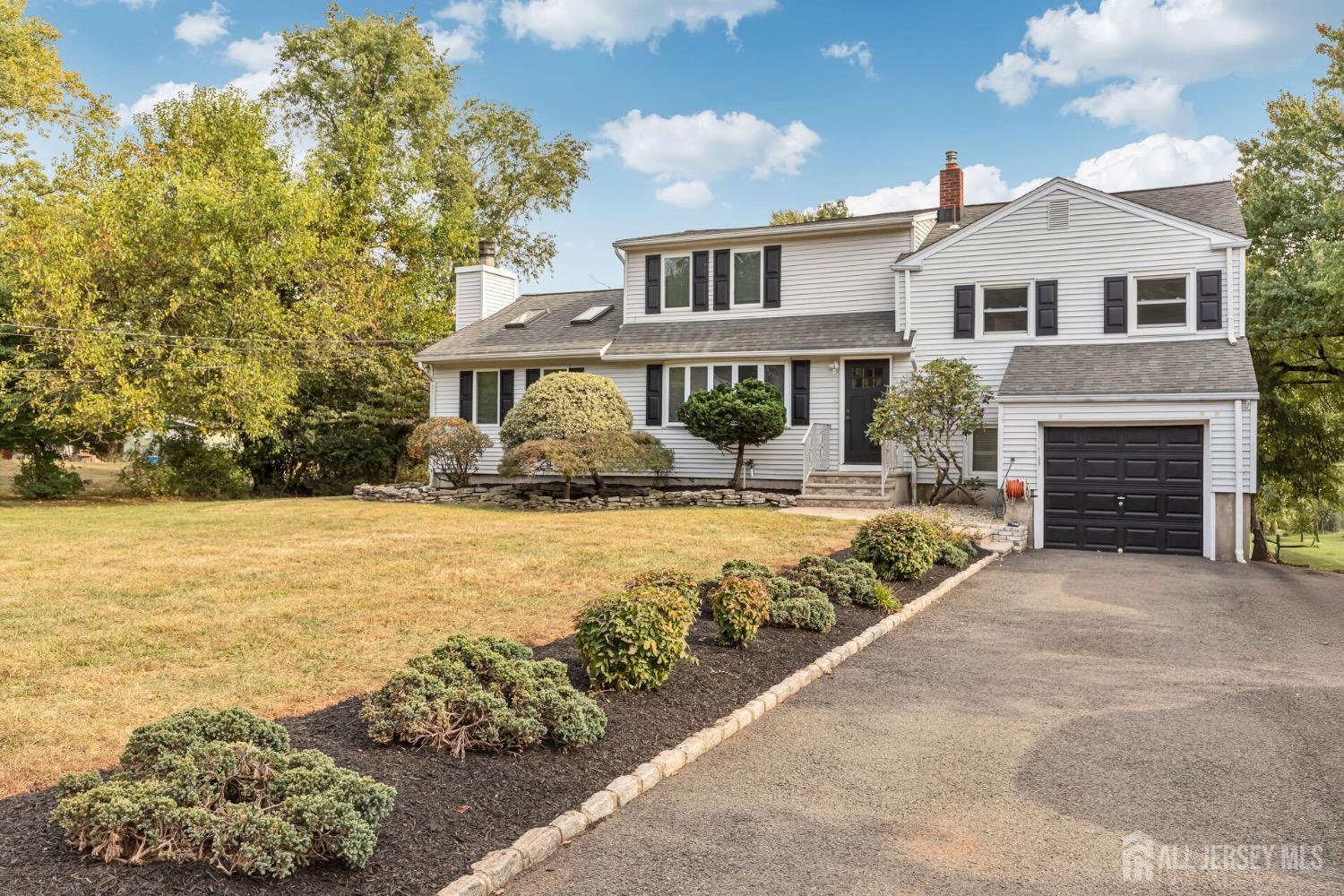 321 Overbrook Road Piscataway, NJ 08854 - Photo 5 of 46 a front view of a house with a yard and ocean view