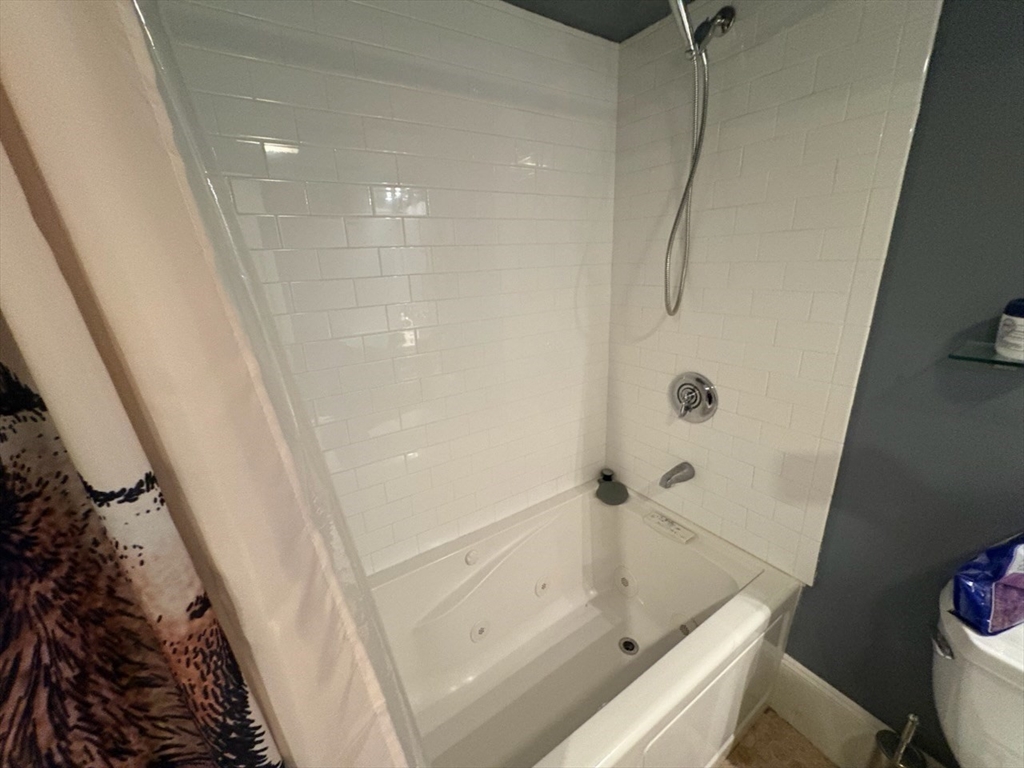 222 Pearl Street, Unit 2 Somerville, MA 02145 - Photo 13 of 15 a bathroom with a tub and sink