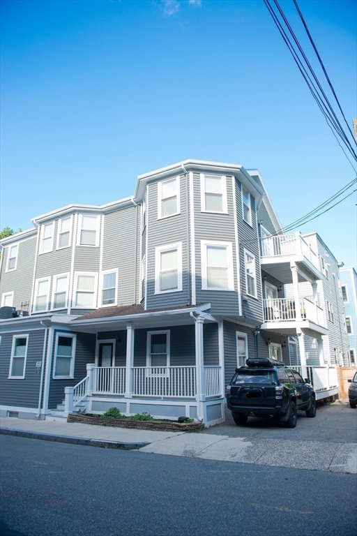 222 Pearl Street, Unit 2 Somerville, MA 02145 - Photo 15 of 15 a car parked in front of a building