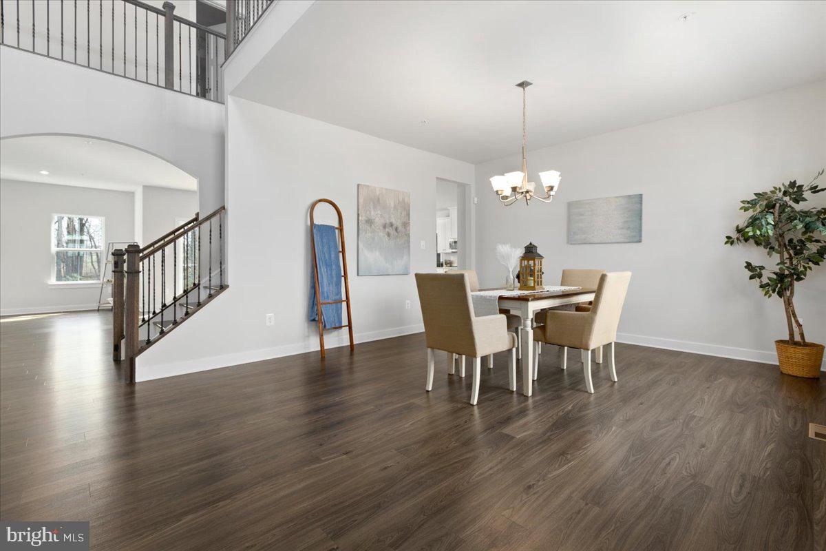 1240 Upper Patuxent Ridge Road Odenton, MD 21113 - Photo 12 of 87 a view of a dining room with furniture and wooden floor