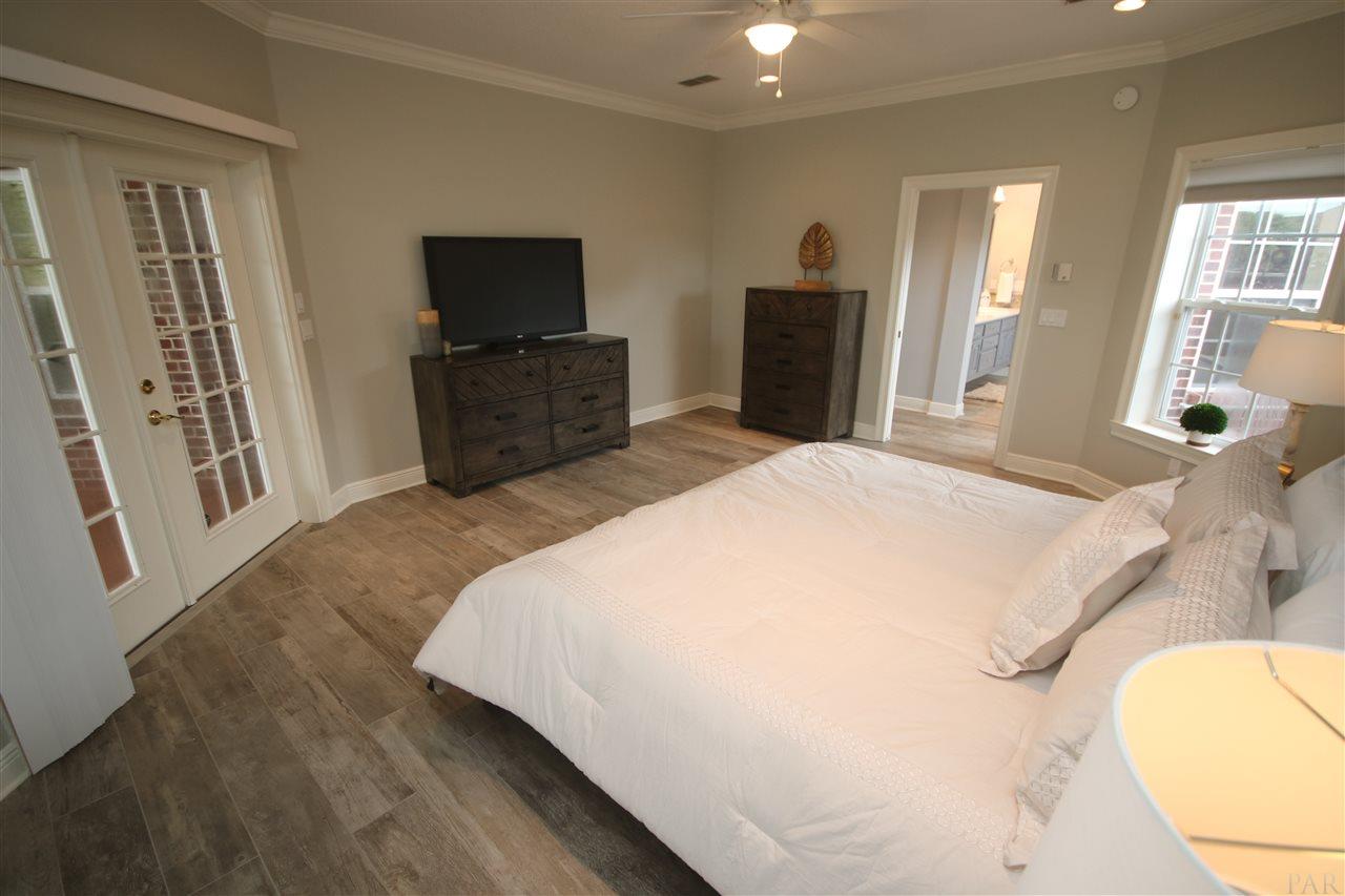 6021 Otter Point Road Pensacola, FL 32504 - Photo 31 of 50 w/ light 5/2019. French doors open to lanai.