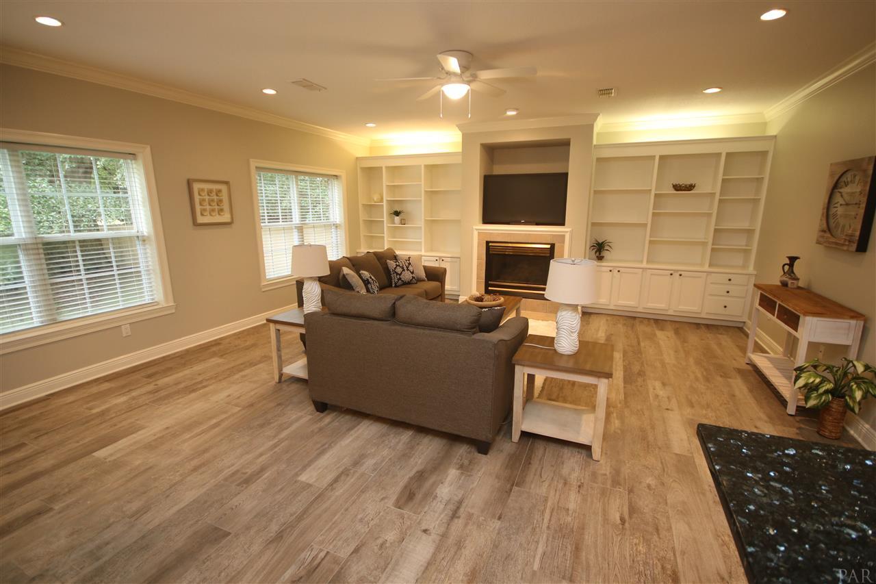 6021 Otter Point Road Pensacola, FL 32504 - Photo 10 of 50 grained Italian tile flooring. Fireplace is gas.