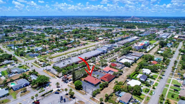 an aerial view of a houses and a yard