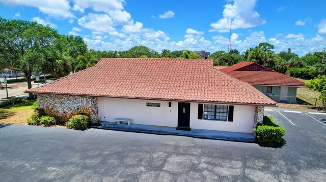 a house with trees in the background