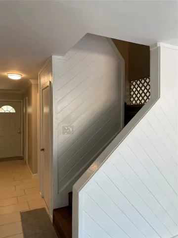 a kitchen with a sink a refrigerator and cabinets
