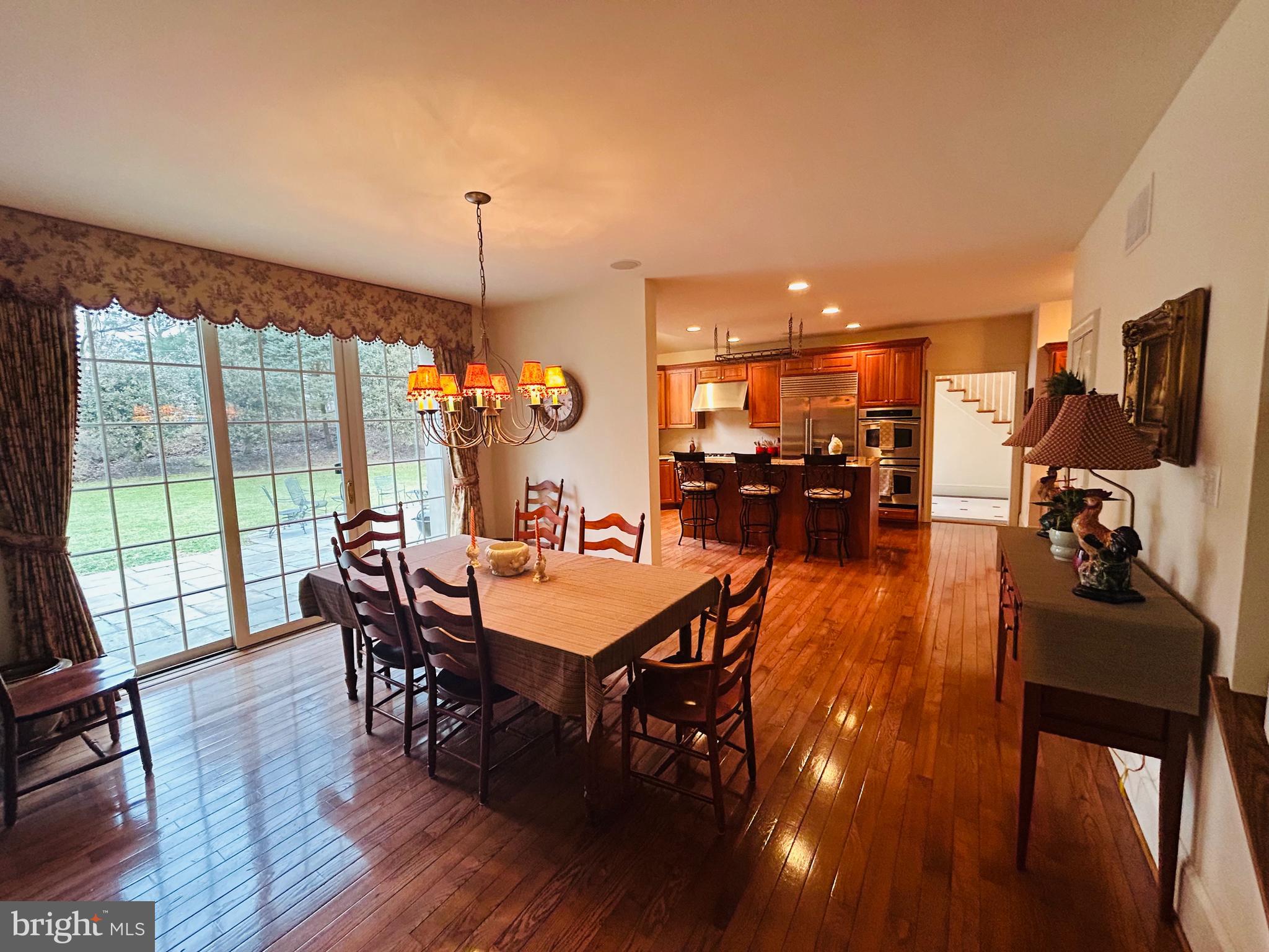 1160 Jefferson Lane Huntingdon Valley, PA 19006 - Photo 31 of 98 a view of a dining room and livingroom with furniture wooden floor a chandelier