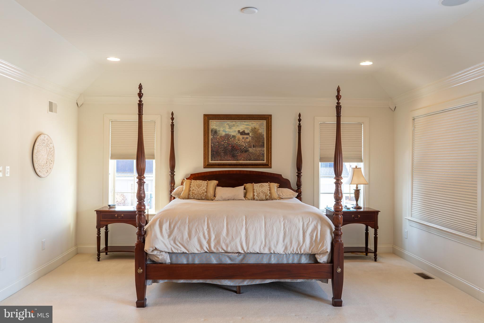 1160 Jefferson Lane Huntingdon Valley, PA 19006 - Photo 39 of 98 a bedroom with a bed lamps and a large mirror