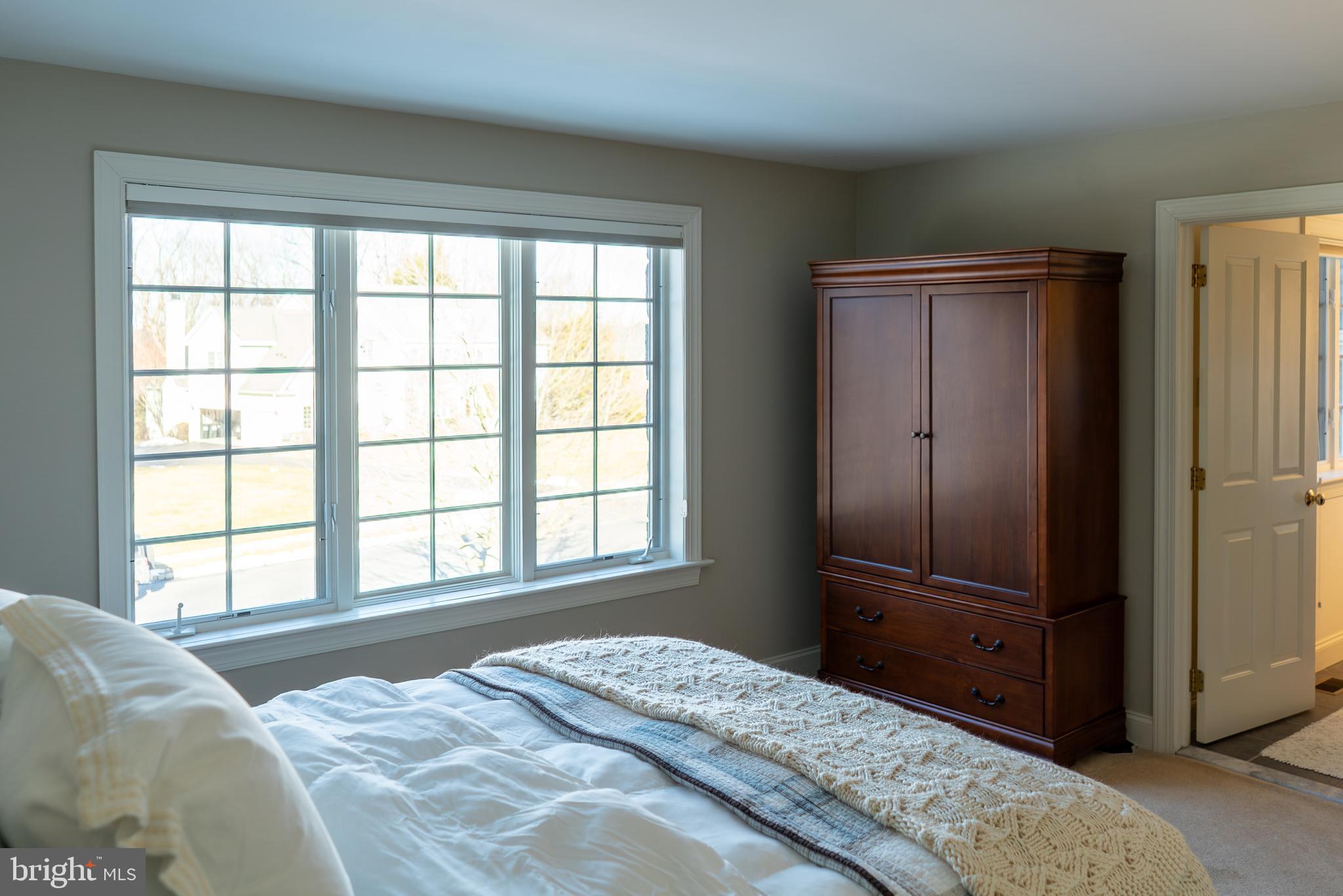 1160 Jefferson Lane Huntingdon Valley, PA 19006 - Photo 47 of 98 a bedroom with a bed and a large window