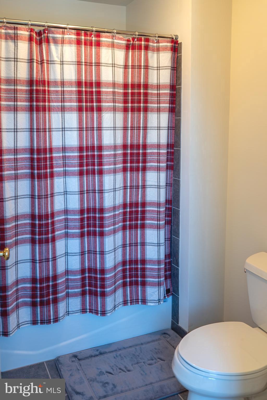 1160 Jefferson Lane Huntingdon Valley, PA 19006 - Photo 49 of 98 a bathroom with a toilet and a shower curtain