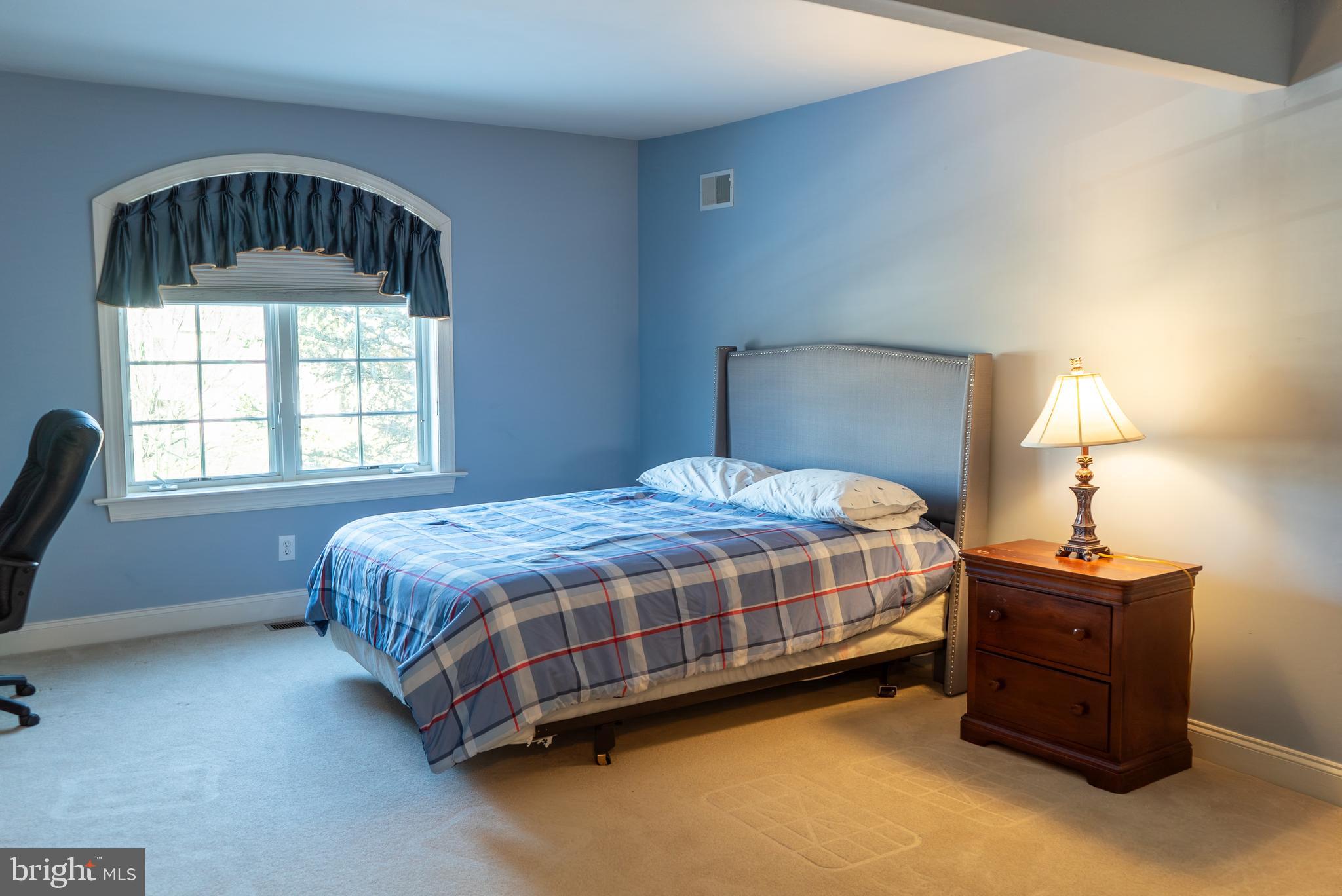 1160 Jefferson Lane Huntingdon Valley, PA 19006 - Photo 55 of 98 a spacious bedroom with a bed a window and dresser