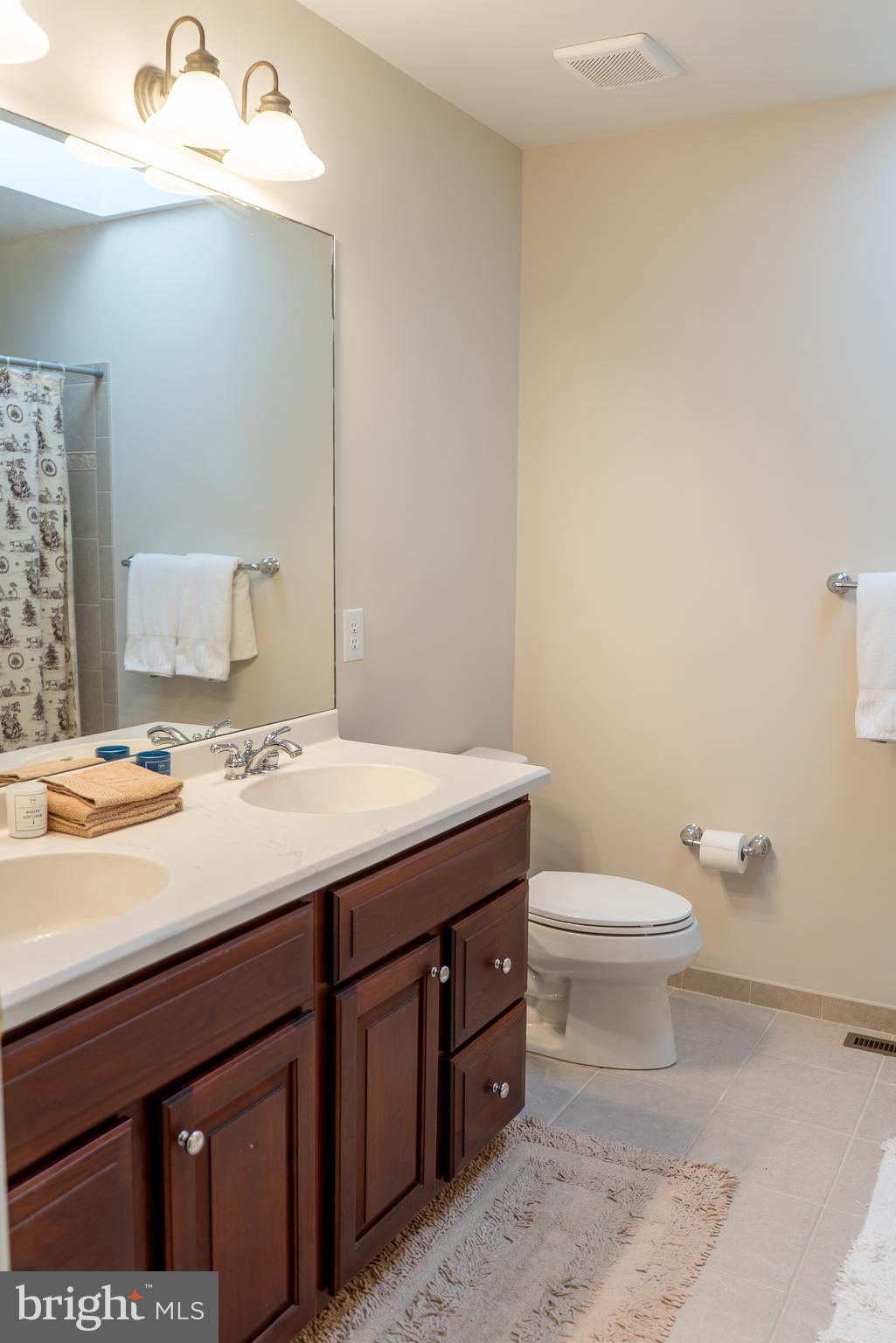 1160 Jefferson Lane Huntingdon Valley, PA 19006 - Photo 59 of 98 a bathroom with a sink a toilet and mirror