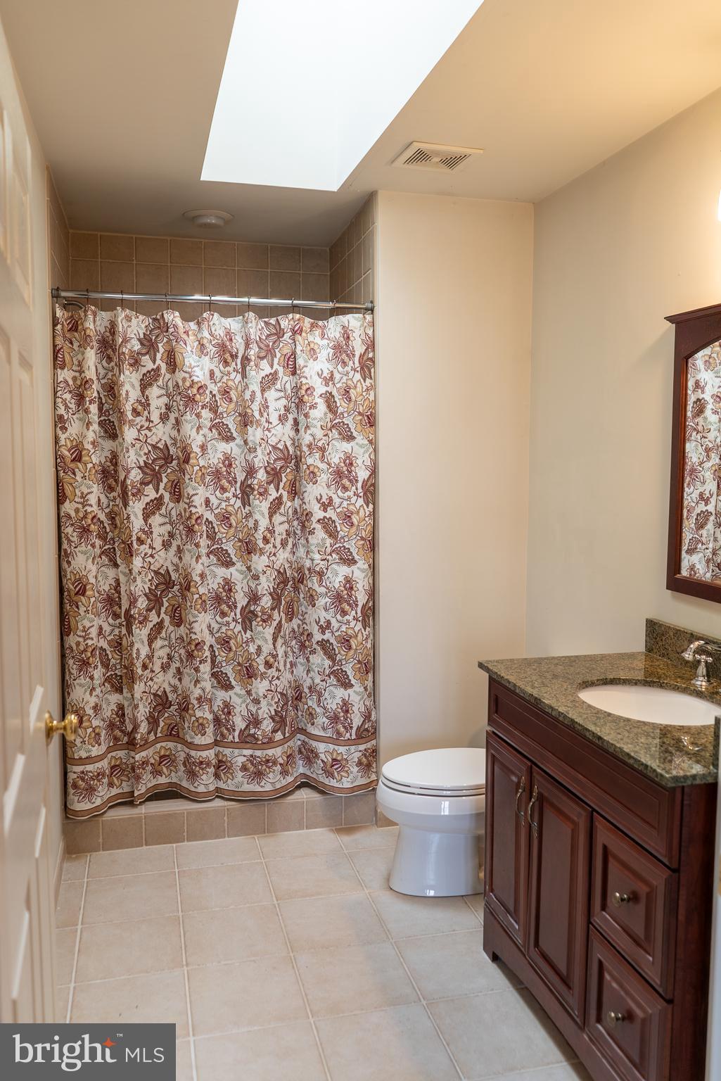1160 Jefferson Lane Huntingdon Valley, PA 19006 - Photo 74 of 98 a bathroom with a granite countertop sink a toilet and a mirror
