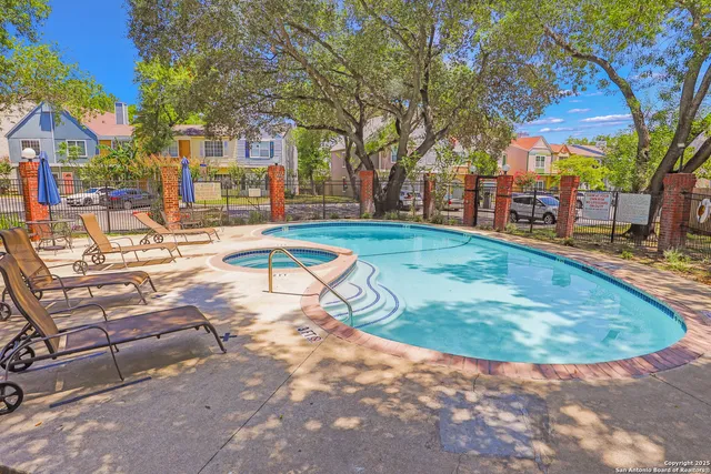 a view of a swimming pool with a patio