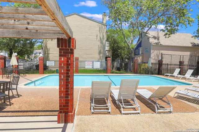 a view of outdoor sitting area with furniture