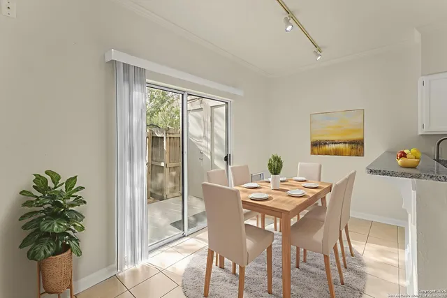 a view of a dining room with furniture window and outside view