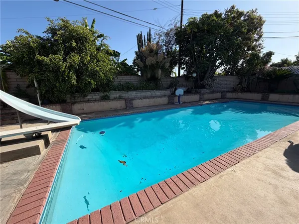 a view of a swimming pool with a patio