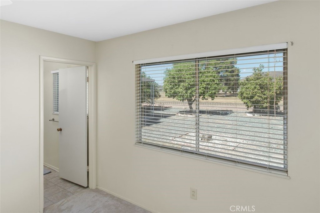 26480 Ridgemoor Road Menifee, CA 92586 - Photo 11 of 32 a view of a room that has a large window