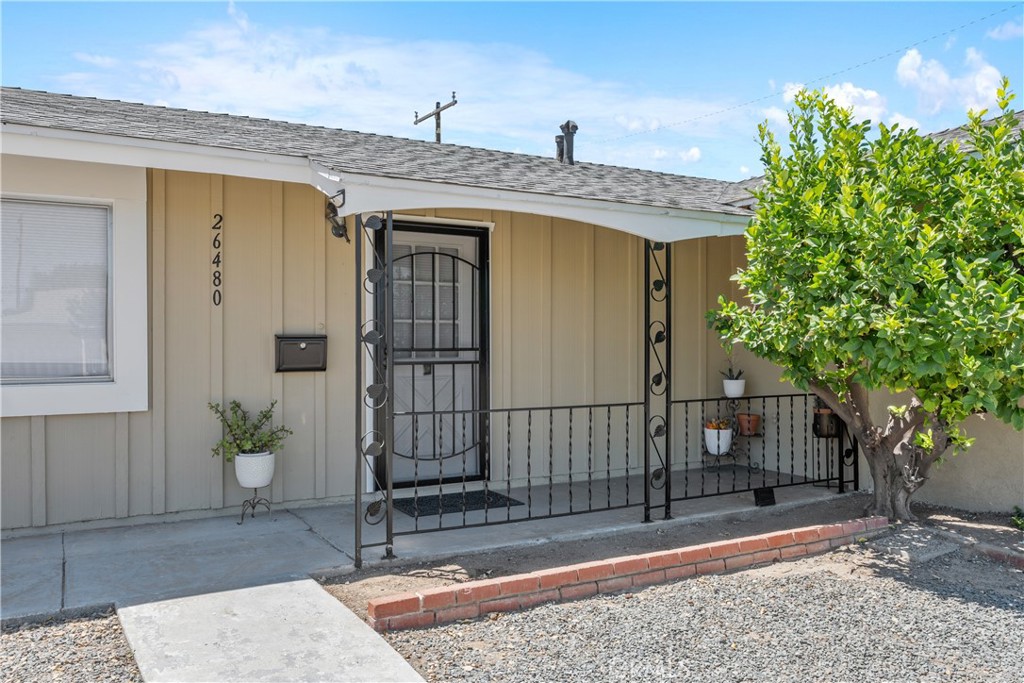 26480 Ridgemoor Road Menifee, CA 92586 - Photo 2 of 32 a view of a patio with table and chairs and potted plants