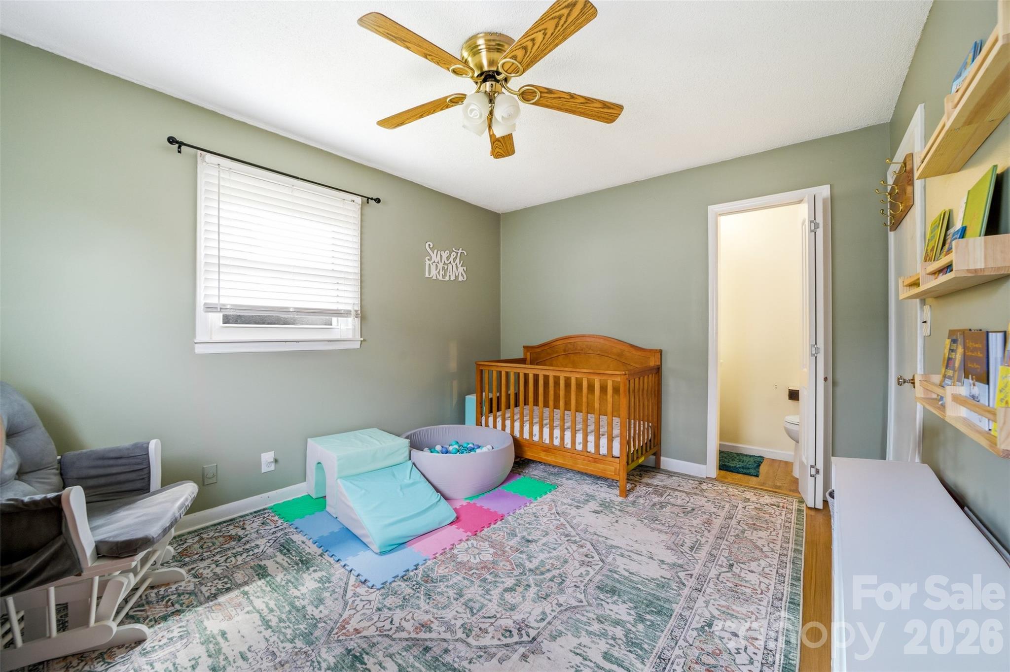 106 Blacksnake Road Stanley, NC 28164 - Photo 12 of 18 a bedroom with a bed and a chandelier