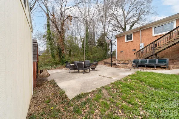 a view of a backyard with a patio