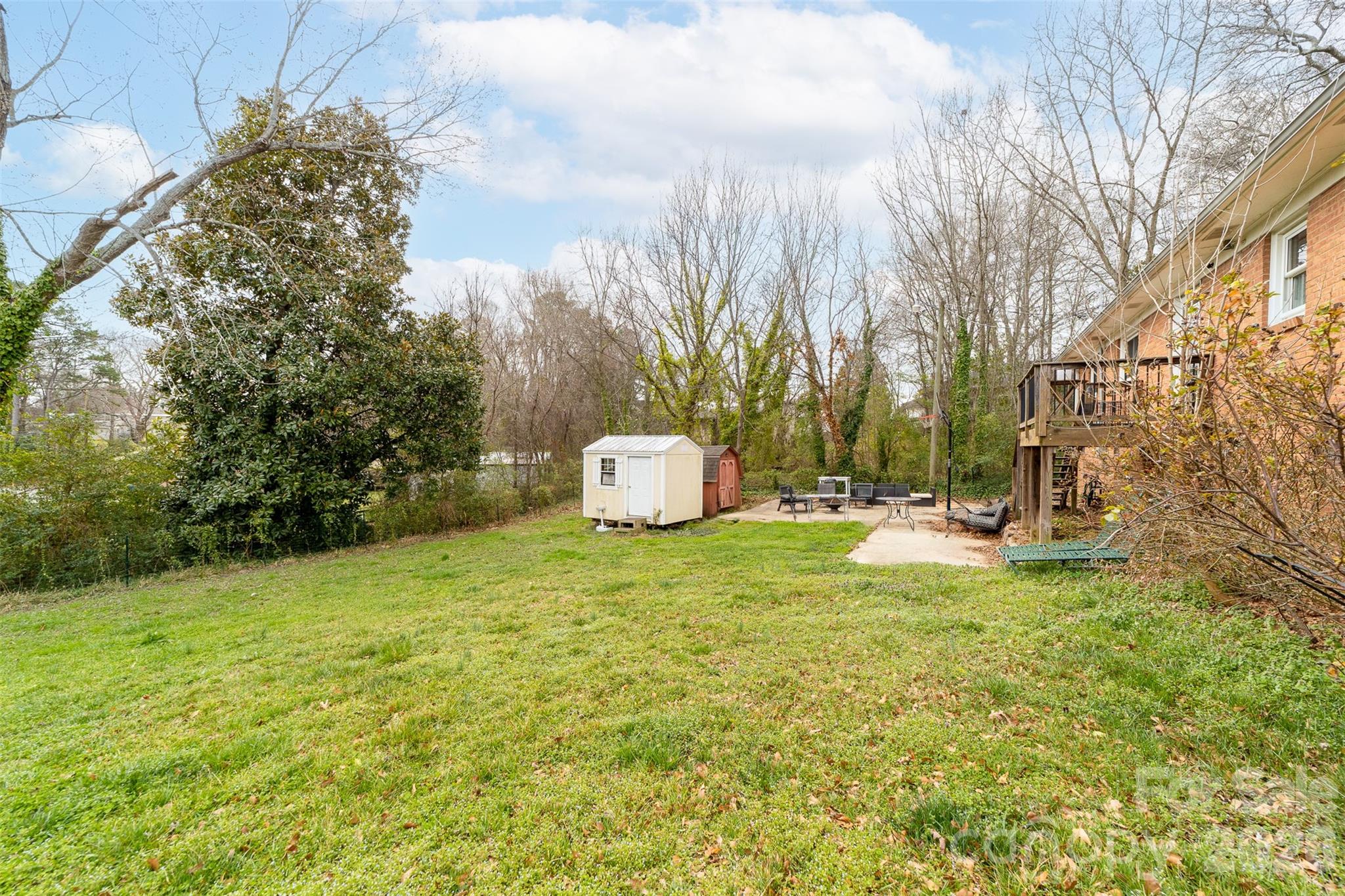 106 Blacksnake Road Stanley, NC 28164 - Photo 5 of 18 a backyard of a house
