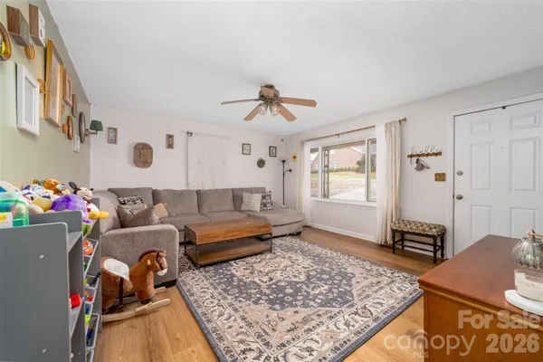 a living room with furniture and a rug
