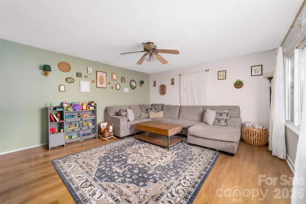 a living room with furniture and a rug