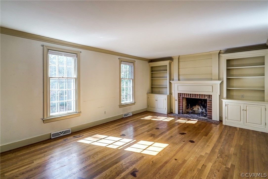 9402 Midvale Road Henrico, VA 23229 - Photo 13 of 33 Family Room with Hardwood Floors, Built-ins, Crown