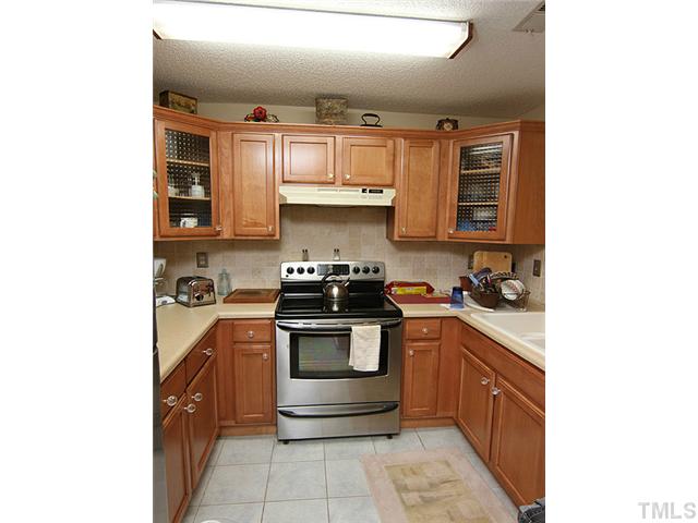 522 Springfork Drive Cary, NC 27513 - Photo 5 of 13 Updated kitchen with new cabinets and stainless steel appliances!
